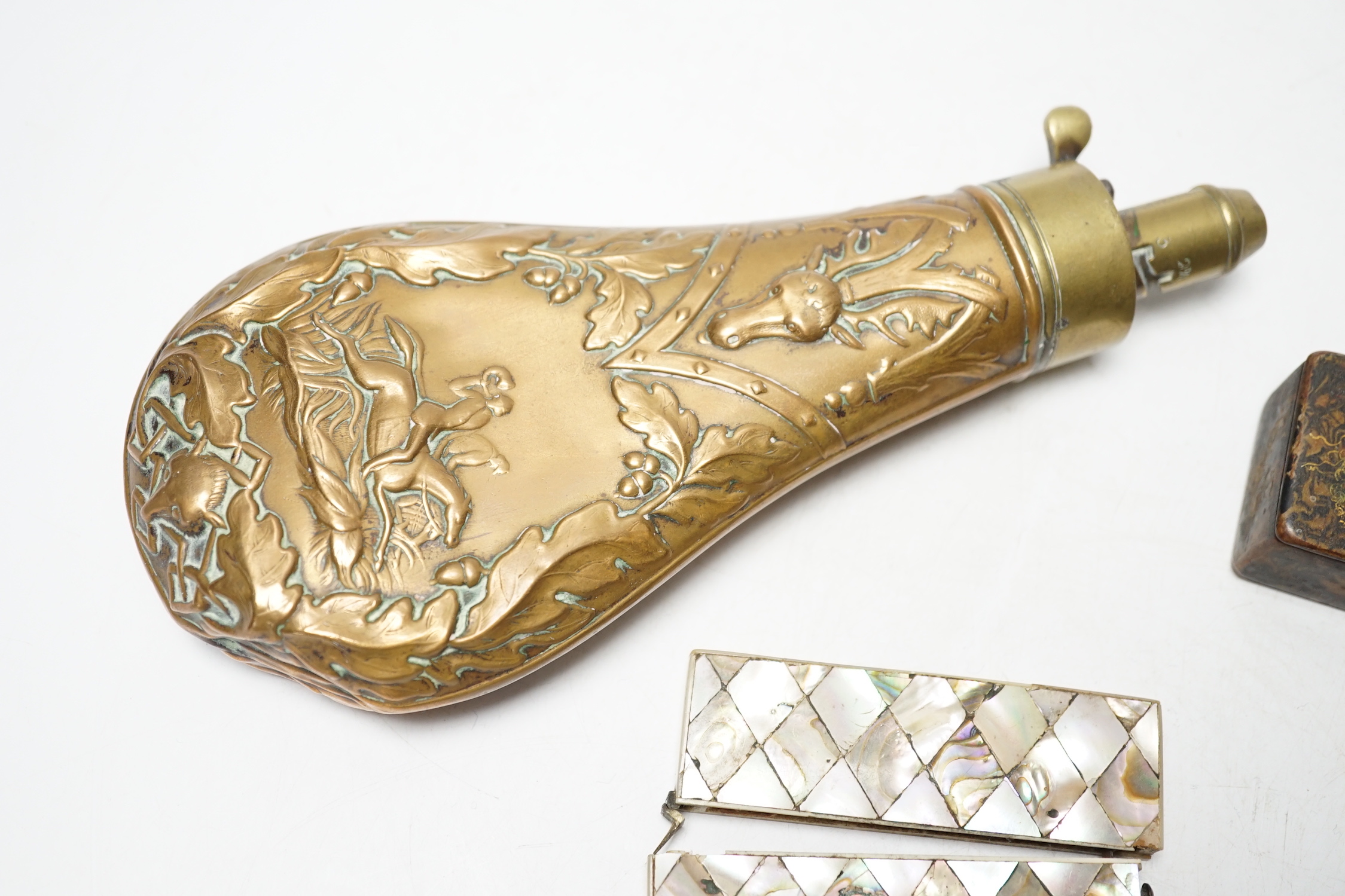 A Victorian embossed brass powder flask, a leather shot flask and a Victorian mother of pearl and abalone calling card case